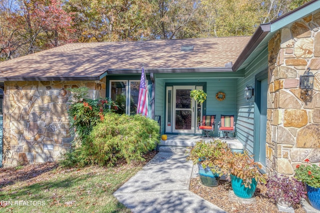 54 Heather Glen Ct, Crossville, TN 38558 - entrance to property with stone siding, a shingled roof, and a porch