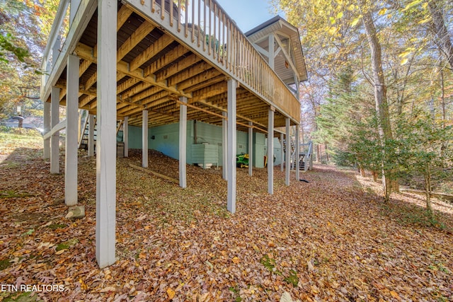 view of side of home featuring a wooden deck