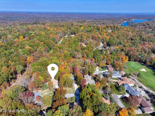 54 Heather Glen Ct, Crossville, TN 38558 - aerial overview of property's location with a heavily wooded area and a golf course