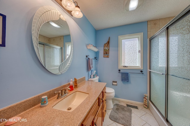 54 Heather Glen Ct, Crossville, TN 38558 - bathroom featuring a shower with shower door, vanity, toilet, tile patterned flooring, and a textured ceiling