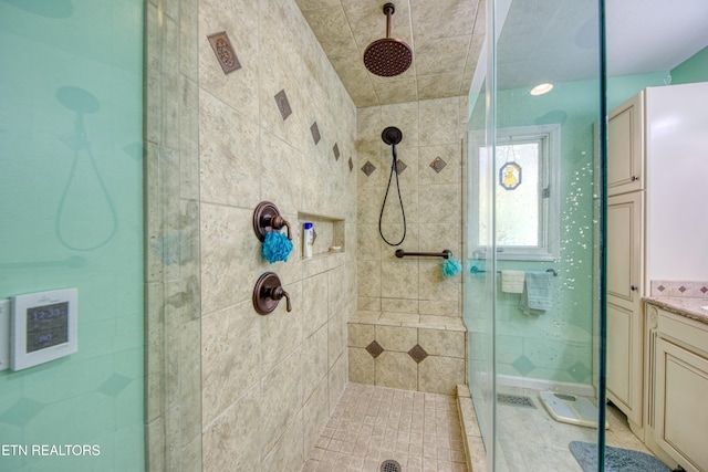 bathroom with vanity and an enclosed shower