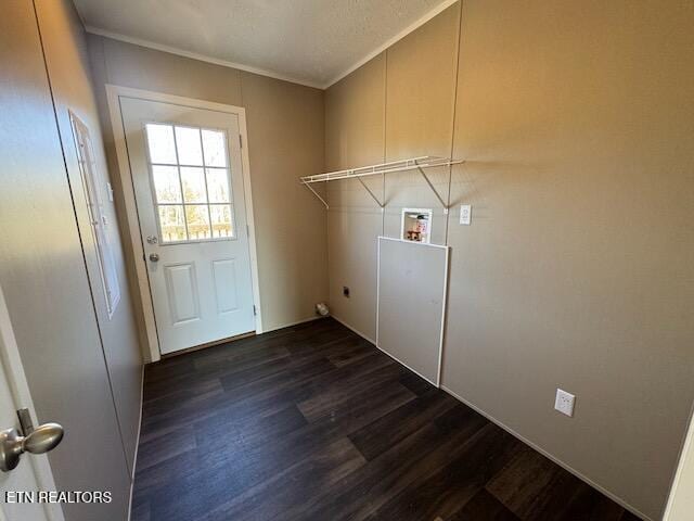 laundry room featuring dark wood-type flooring, washer hookup, and ornamental molding