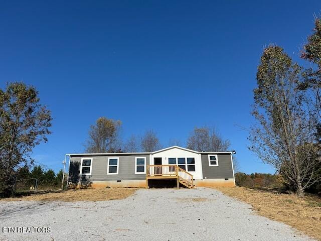 manufactured / mobile home featuring a wooden deck