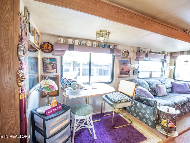 living room with beam ceiling