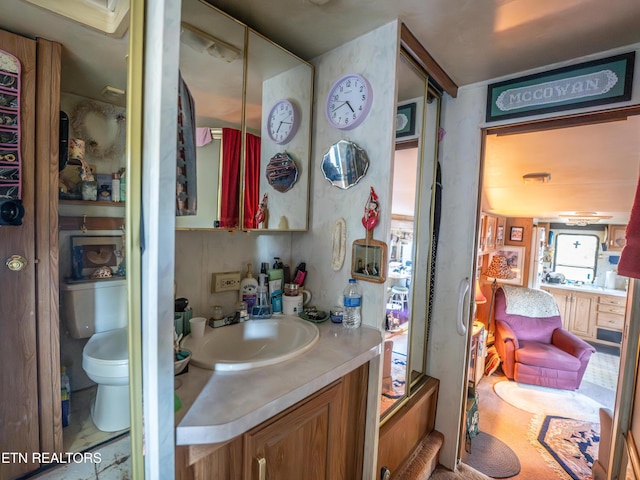 bathroom with vanity and toilet