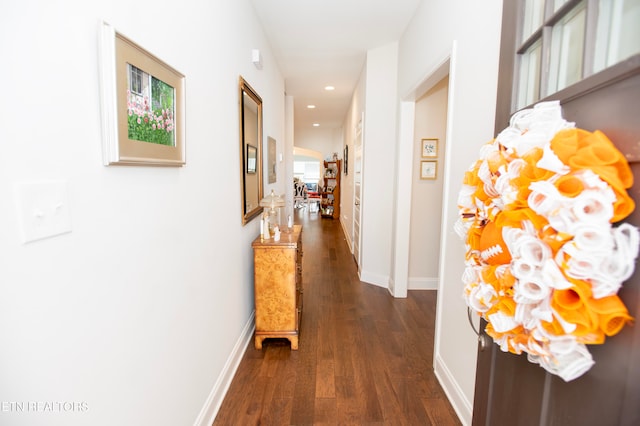 hall with dark hardwood / wood-style floors