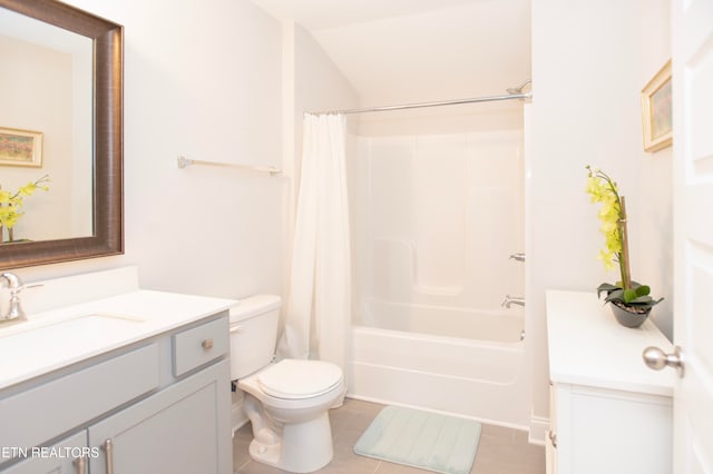 full bathroom featuring toilet, vanity, tile patterned floors, and shower / tub combo with curtain