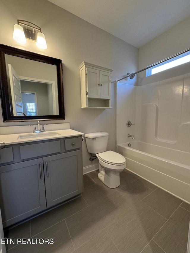 full bathroom featuring tile patterned floors, vanity,  shower combination, and toilet