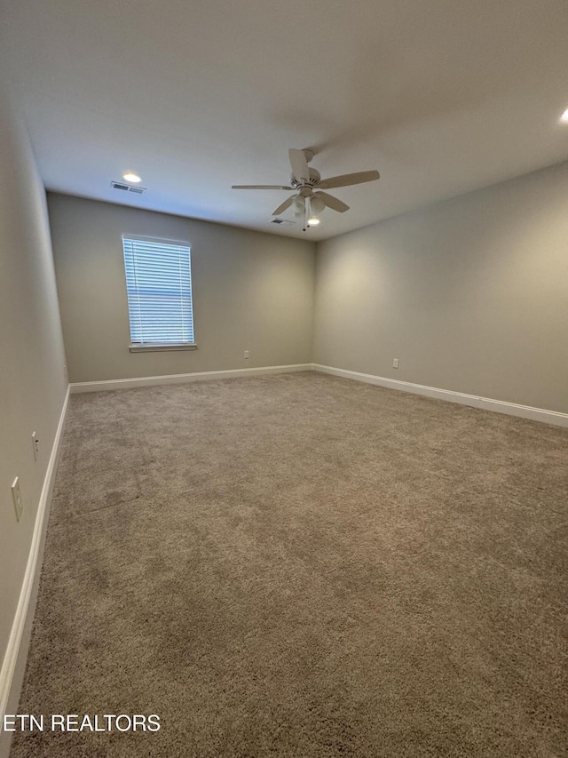 carpeted empty room with ceiling fan