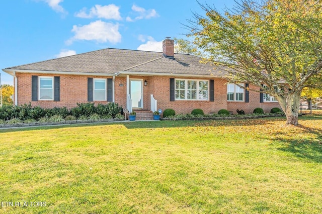 ranch-style home with a front lawn