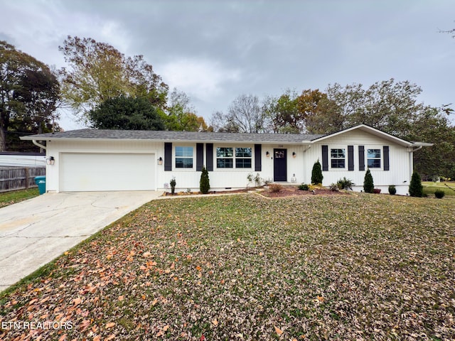 single story home with a garage and a front yard