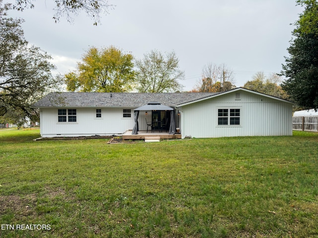 rear view of house with a lawn