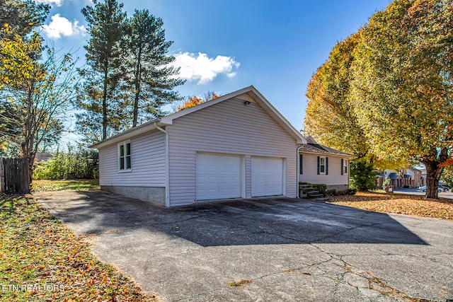 view of side of property featuring a garage