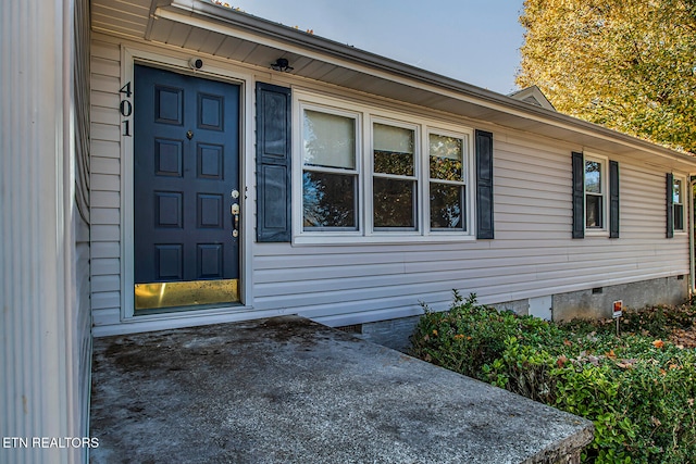 property entrance with a patio area