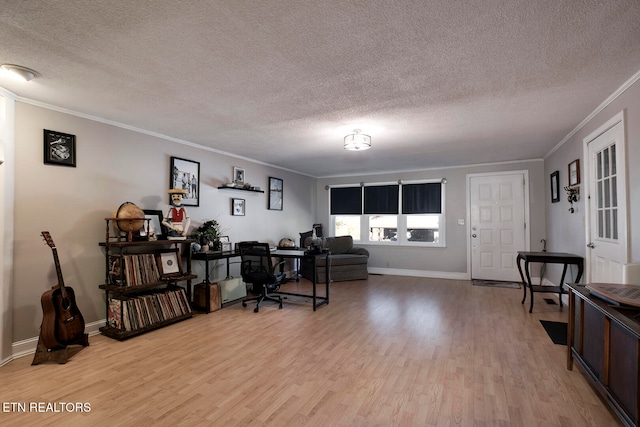 office space with light hardwood / wood-style flooring, a textured ceiling, and crown molding