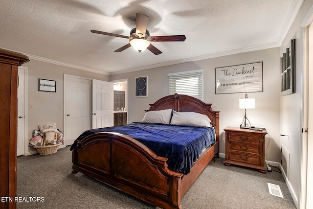 bedroom featuring a textured ceiling, carpet, and ceiling fan