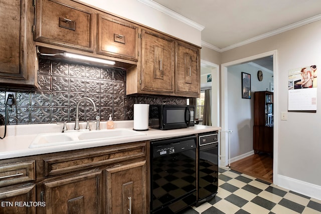 kitchen featuring decorative backsplash, black appliances, sink, and crown molding