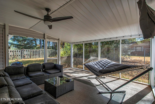 sunroom / solarium featuring wood ceiling, vaulted ceiling, and ceiling fan