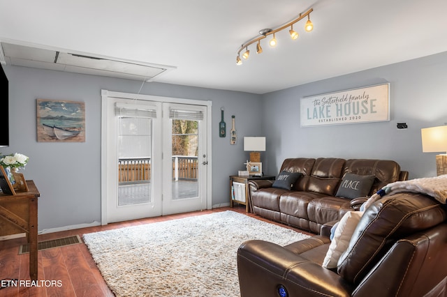 living room featuring dark wood-type flooring