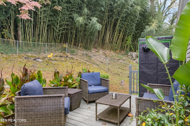 wooden terrace featuring an outdoor hangout area