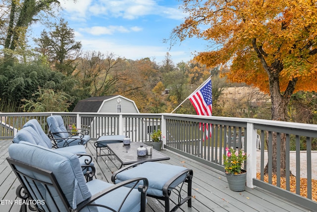 wooden deck with an outdoor hangout area