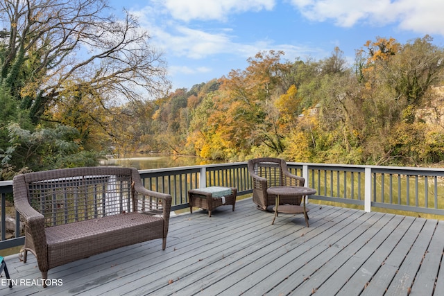 wooden terrace with a water view