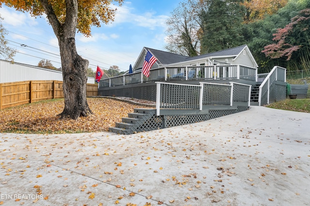 back of property with a wooden deck