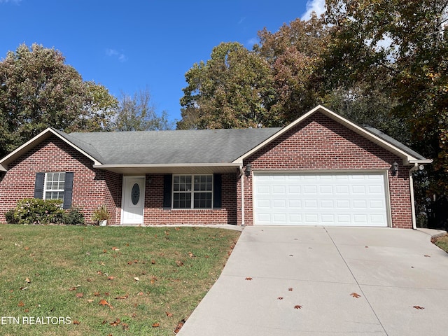 ranch-style home with a front lawn and a garage