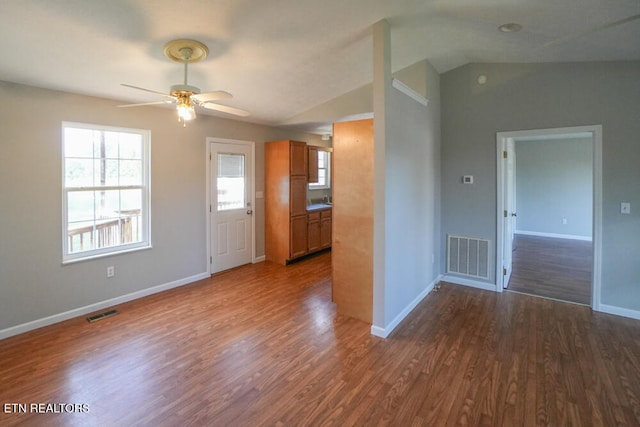 interior space featuring lofted ceiling, dark wood-type flooring, and ceiling fan