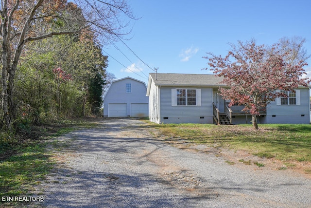 view of front of home with an outbuilding and a garage