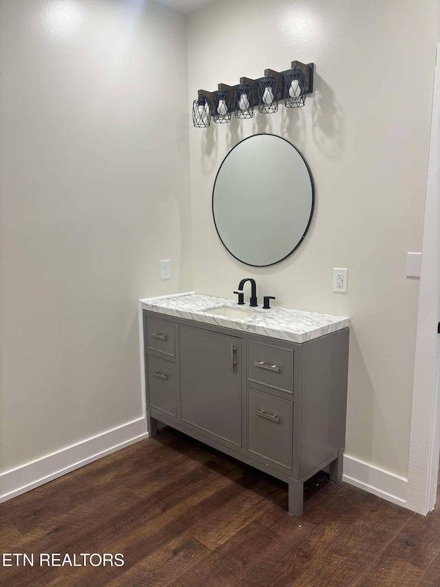 bathroom featuring vanity and hardwood / wood-style flooring