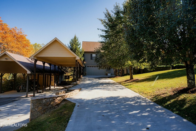 view of front of house with a front yard and a garage