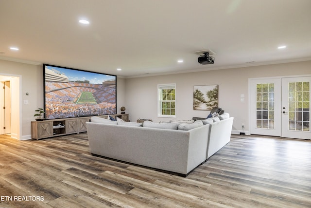 living room featuring light hardwood / wood-style flooring and ornamental molding