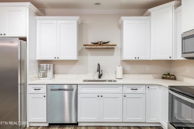 kitchen featuring white cabinetry, sink, and stainless steel appliances