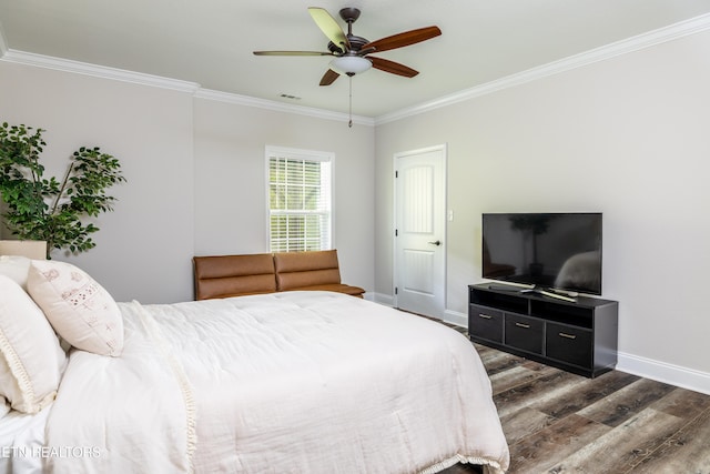 bedroom featuring ceiling fan, ornamental molding, and dark wood-type flooring