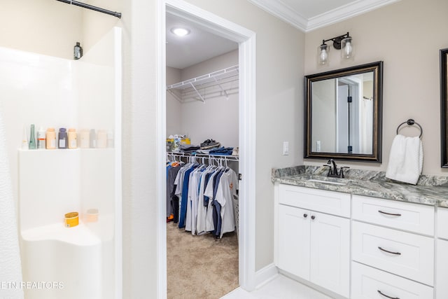 bathroom featuring vanity and ornamental molding