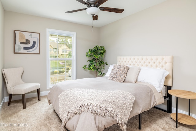 carpeted bedroom featuring ceiling fan