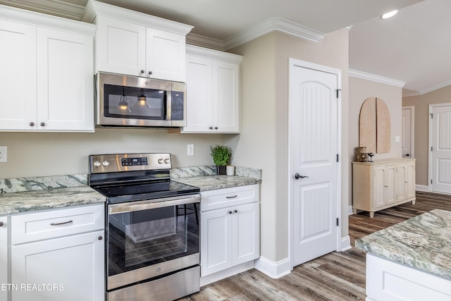 kitchen featuring white cabinetry, crown molding, light stone countertops, and appliances with stainless steel finishes