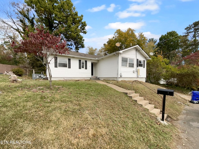 view of front of home with a front lawn