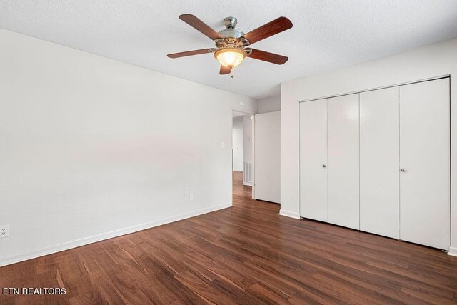 8709 Olde Colony Trl Unit 12, Knoxville, TN 37923 - unfurnished bedroom with wood finished floors, baseboards, a closet, and ceiling fan
