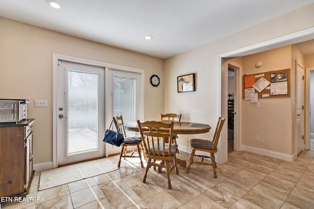 dining area featuring baseboards and recessed lighting