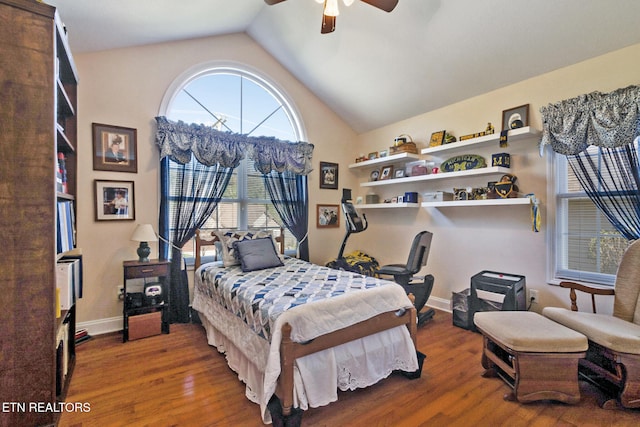 bedroom with ceiling fan, high vaulted ceiling, wood finished floors, and baseboards