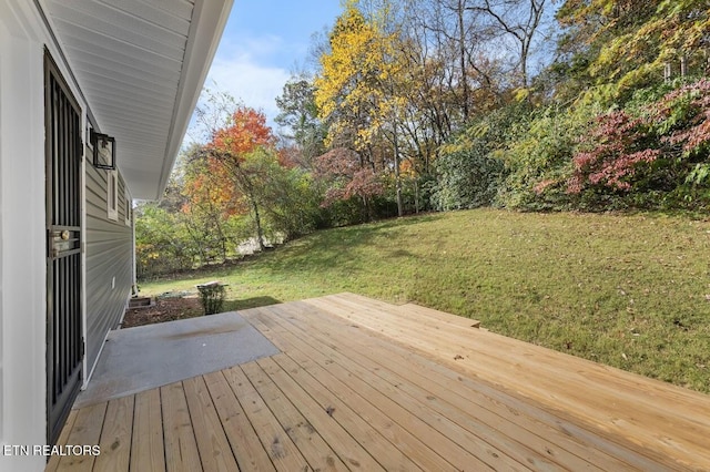 wooden deck with a yard