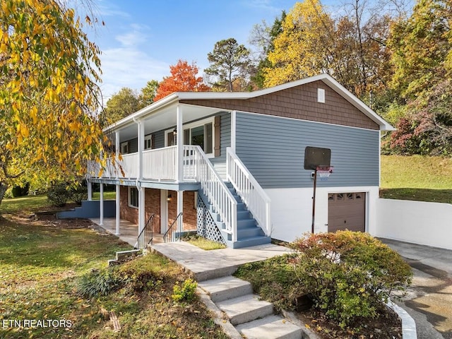 view of front facade with a garage and a porch