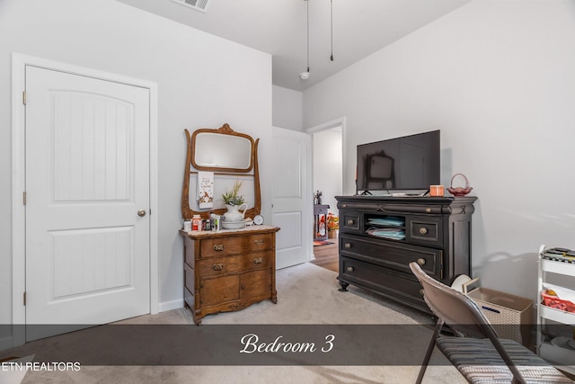 bedroom with light carpet