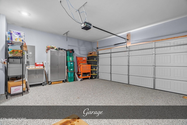 garage featuring a garage door opener