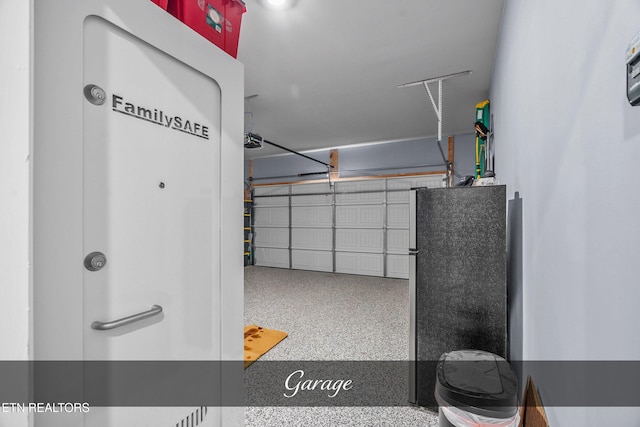 garage featuring stainless steel fridge