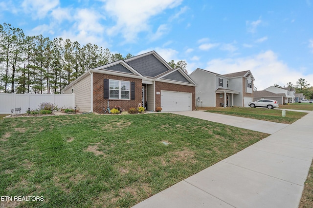 view of front of home featuring a front lawn and a garage