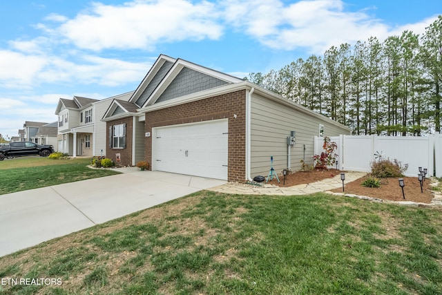 view of front facade featuring a front lawn and a garage