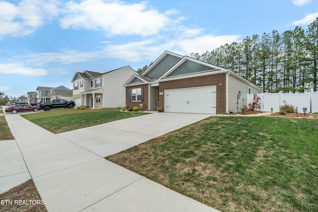 view of front of house featuring a front yard and a garage